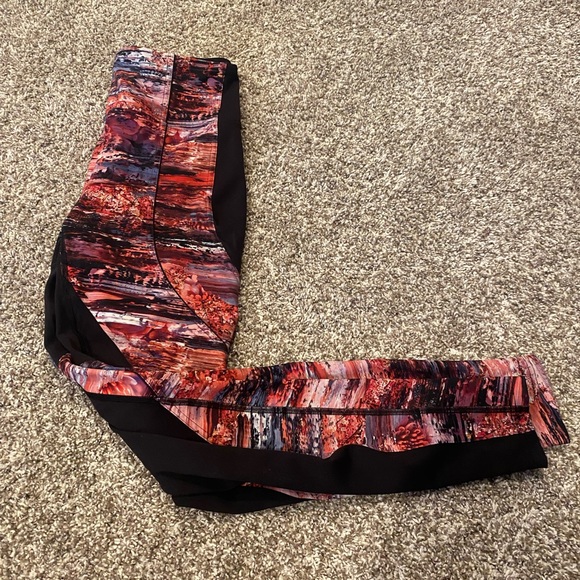 Cute high rise, full length Lululemon leggings with sections of pink pattern. - Picture 4 of 4